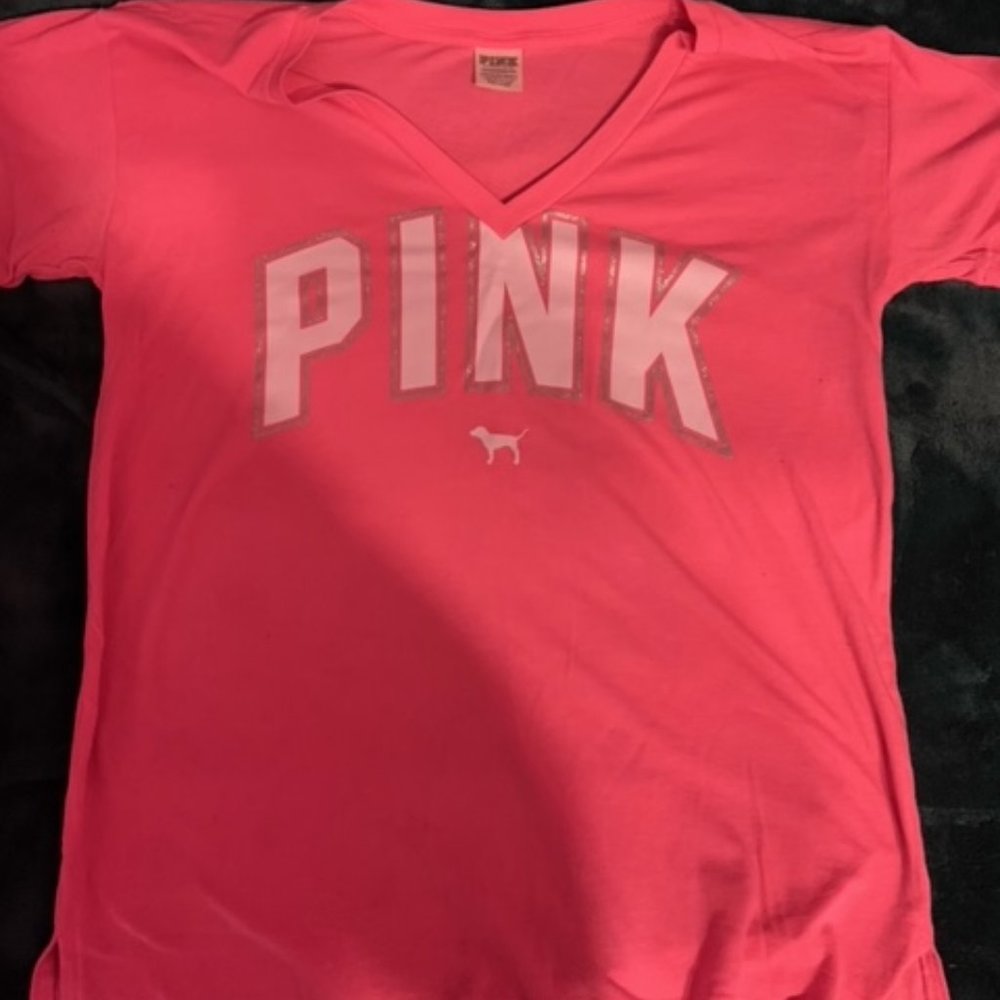 Victoria’s Secret pink T-shirt.